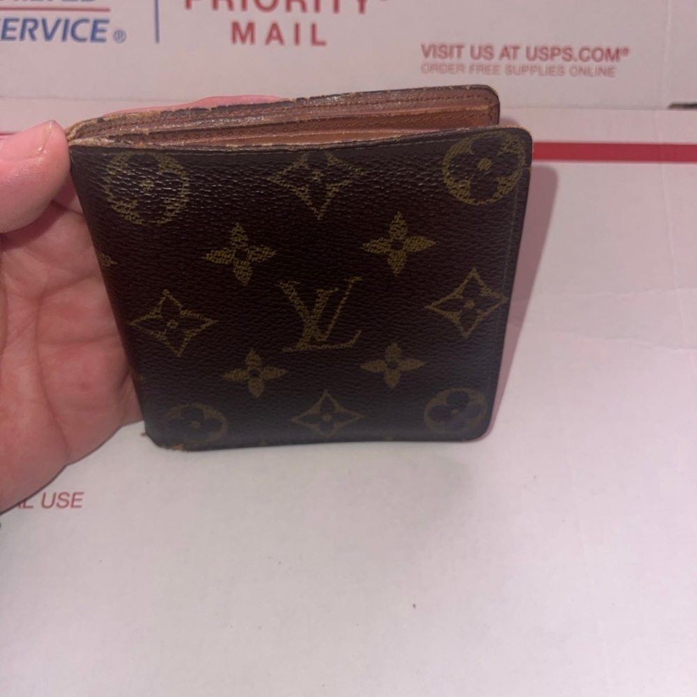 Vintage Louis Vuitton monogram wallet
Made in France July of 1990